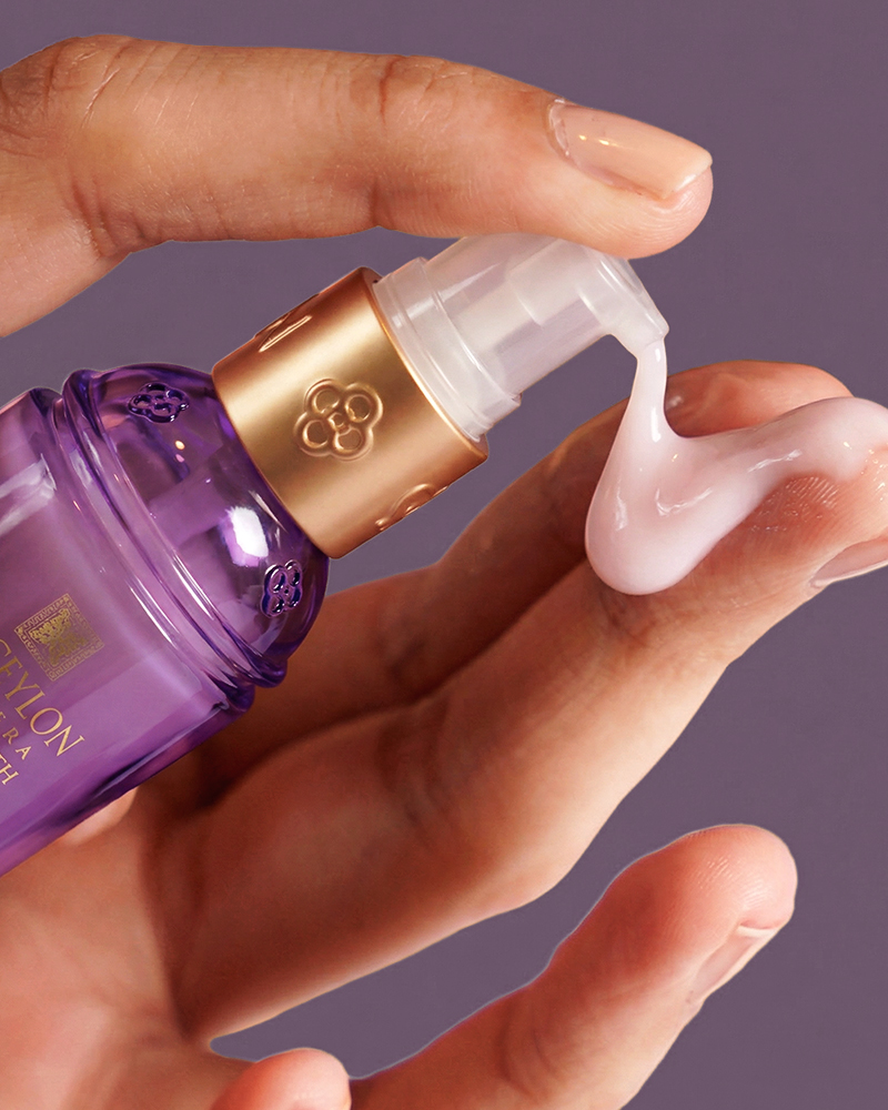 Hands applying Spa Ceylon skincare cream